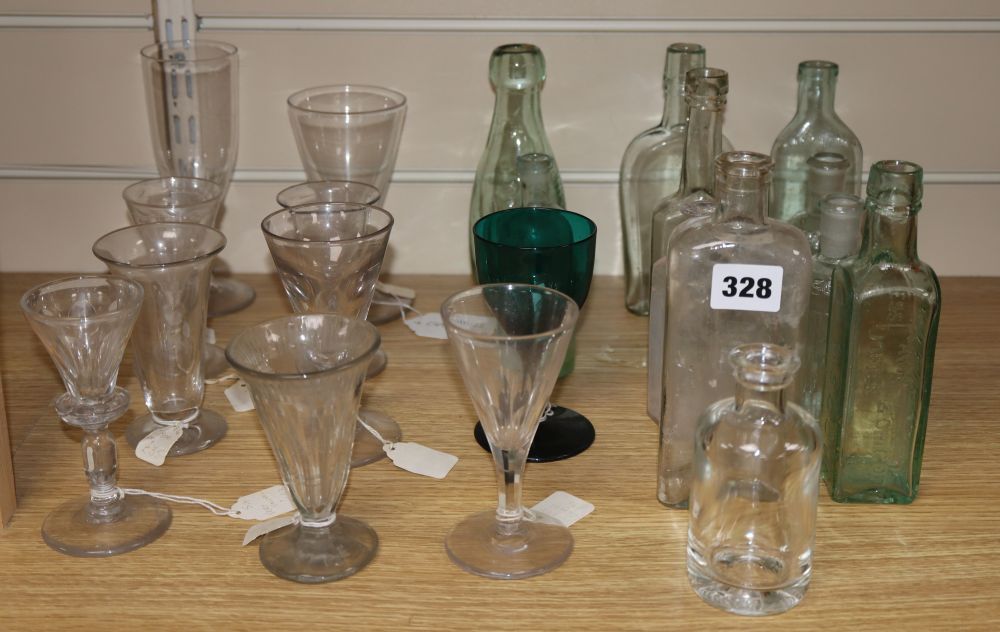 A quantity of glasses and glass bottles